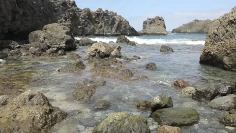 Natural lava pool by the ocean Stock Footage 106624655