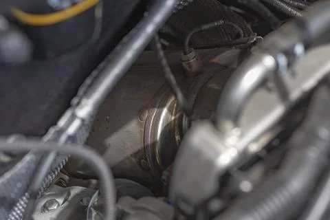 Natural light. the car. Engine compartment. Low depth of field. Silencer with Stock Photos