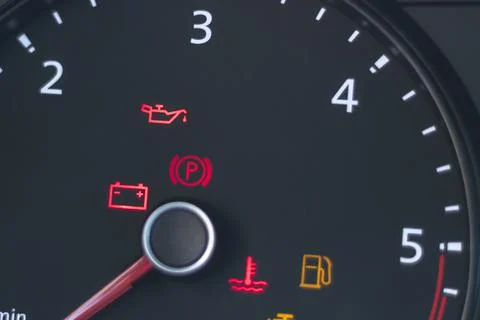 Natural light. the dashboard of the car. The engine error indicator lights up Stock Photos