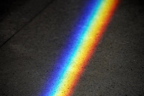 Natural Light refraction in Rainbow inside ancient stone building Stock Photos