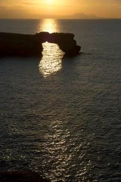 Natural limestone arch at sunset Foto stock