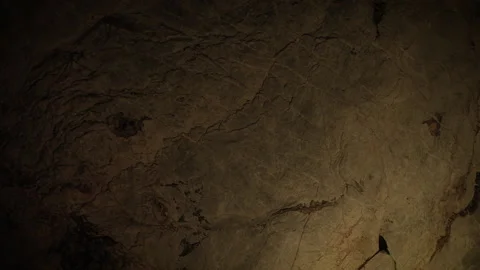Natural limestone cave texture with stalactites and stalagmites in darkness. Stock Footage 321702801