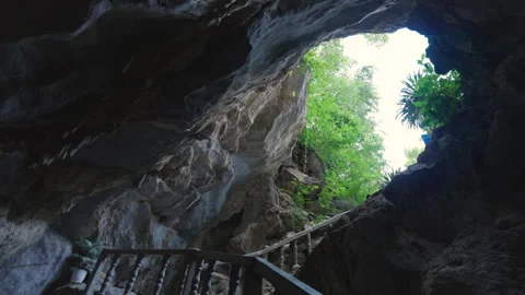 Natural limestone cave texture with stalactites and stalagmites in darkness. Stock Footage 321751767