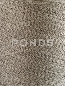 Natural linen yarn bobbin closeup Stock Photos