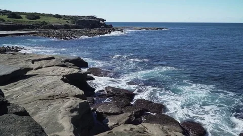 Natural ocean wave hit cliff rock in the summer Stock Footage 78984784