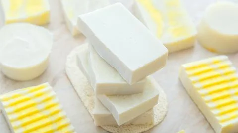Natural olive soap bars pattern. Many various white homemade bar soaps. Handmade Stock Photos