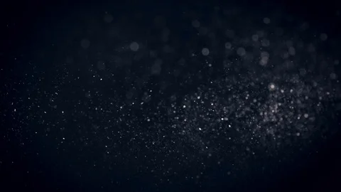 Natural Organic Dust Particles Float On Black Background. Dust In Motion. Vidéo 86559401