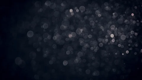 Natural Organic Dust Particles Float On Black Background. Dust In Motion. Vidéo 86559474