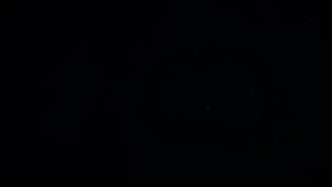 Natural Organic Dust Particles Float On Black Background. Dust In Motion. 库存影片 247559077