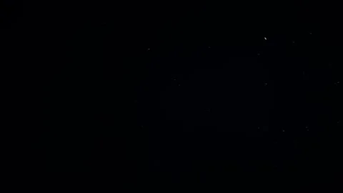 Natural Organic Dust Particles Float On Black Background. Dust In Motion. Stock Footage 247559191