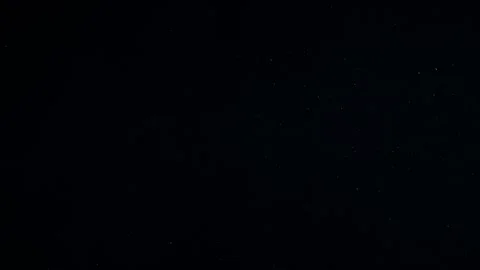 Natural Organic Dust Particles Float On Black Background. Dust In Motion. Vidéo 247579163