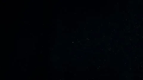 Natural Organic Dust Particles Float On Black Background. Dust In Motion. Stock Footage 247776205