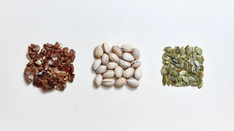 Natural organic nuts pattern in the form of square from walnuts, pistachio and Foto stock