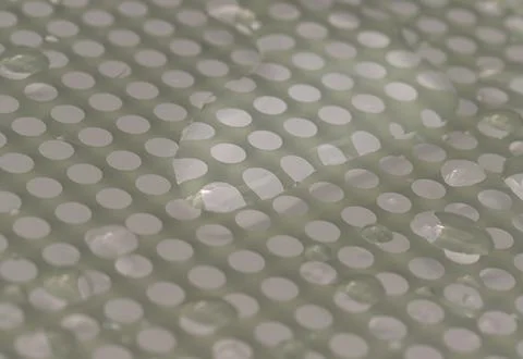 Natural Pattern of dew drops or raindrops on galss background. Stock Photos
