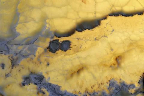 Natural pattern of onyx yellow colour polished disc mineral. Super high Stock Photos