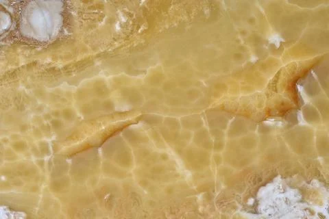 Natural pattern of onyx yellow colour polished disc mineral. Super high Stock Photos
