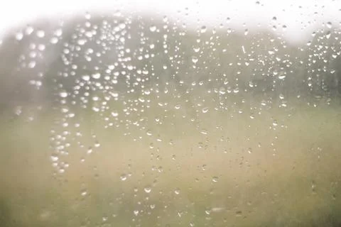 Natural pattern of rain drops on window glass surface. Stock Photos