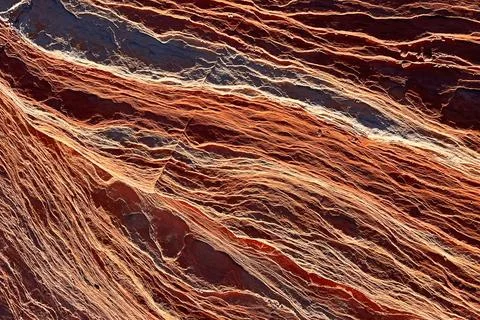 Natural patterns of red and orange minerals in rock formations in the deser.. Stock Photos