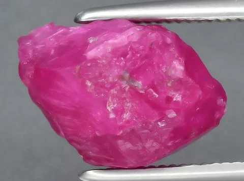 Natural pink red ruby gem on the background 写真素材