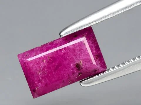 Natural pink red ruby gem on the background 写真素材