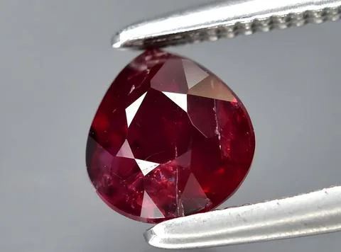 Natural pink red ruby gem on the background 写真素材