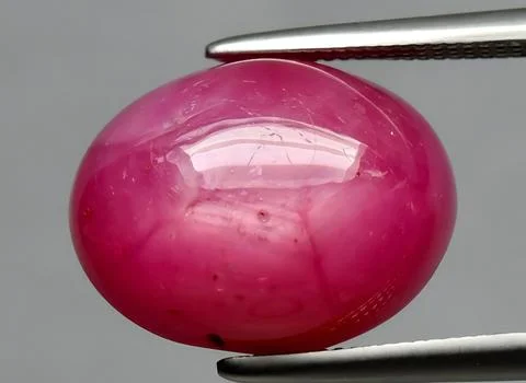 Natural pink ruby gem on the background Stock Photos