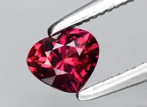 Natural pink ruby gem on the background Stock Photos