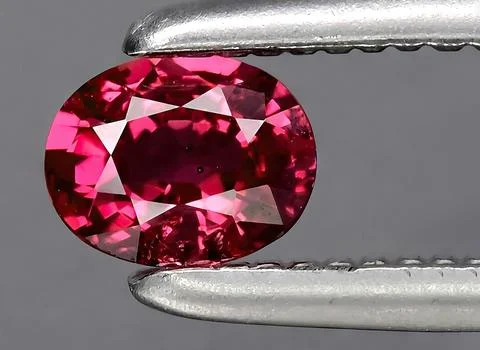 Natural pink ruby gem on the background Stock Photos