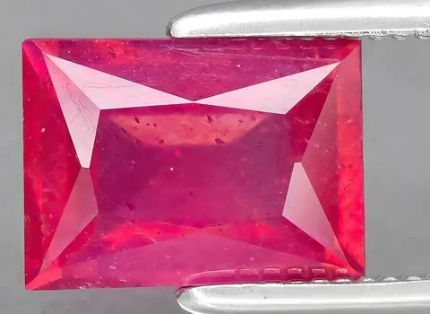 Natural pink ruby gem on the background Stock Photos