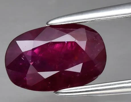 Natural pink ruby gem on the background Stock Photos