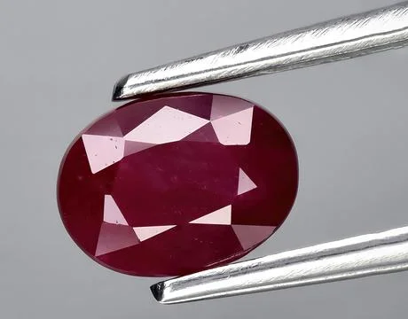 Natural pink ruby gem on the background Stock Photos