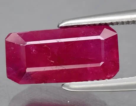 Natural pink ruby gem on the background Stock Photos