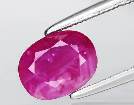 Natural pink ruby gem on the background 스톡 사진