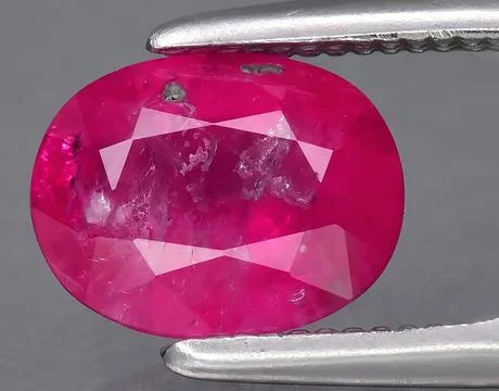 Natural pink ruby gem on the background Stock Photos