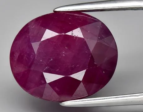 Natural pink ruby gem on the background Stock Photos