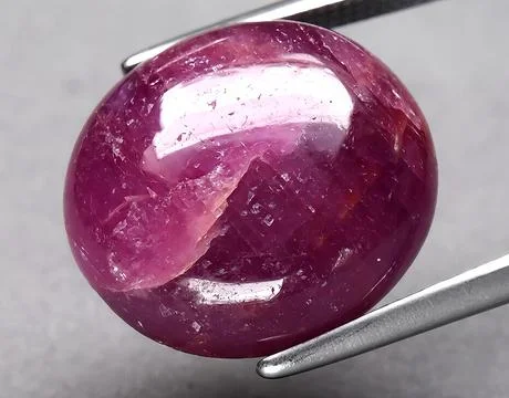Natural pink ruby gem on the background 스톡 사진