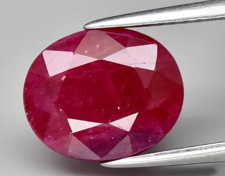 Natural pink ruby gem on the background 스톡 사진