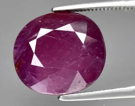 Natural pink ruby gem on the background 스톡 사진