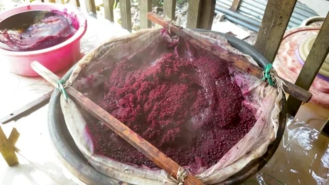 Natural Plant Based Dye Paste Being Strained Through Traditional Bamboo Filter Stock-Footage 336804887