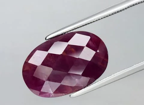 Natural purple ruby gem on the background Stock Photos