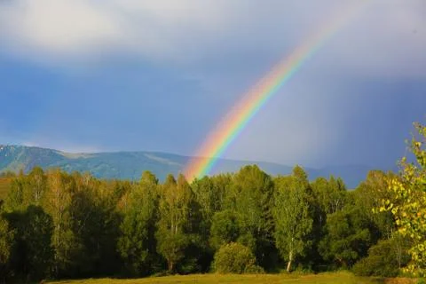 Natural rainbow in the mountains Stock Photos