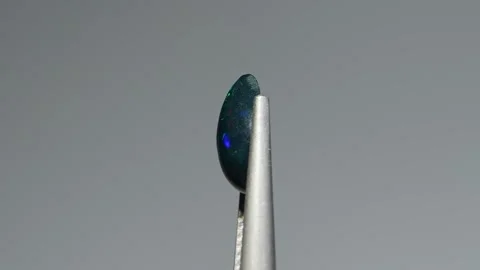Natural rainbow opal gem on the background Stock Footage 278548417