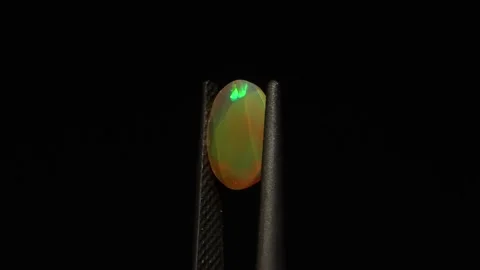 Natural rainbow opal gem on the background Stock Footage 278548488