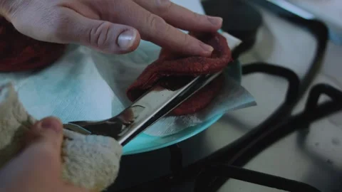 Natural recipe scene: lifting a cooked beet tortilla Stock Footage 342173571