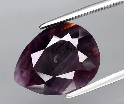 Natural red ruby corrundum gem on the background 스톡 사진