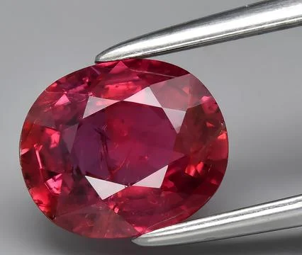 Natural red ruby corrundum gem on the background Stock Photos