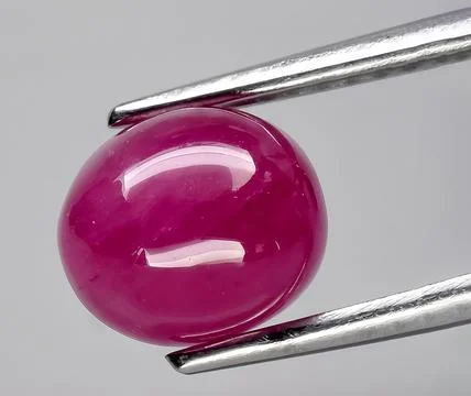 Natural red ruby corrundum gem on the background Stock Photos