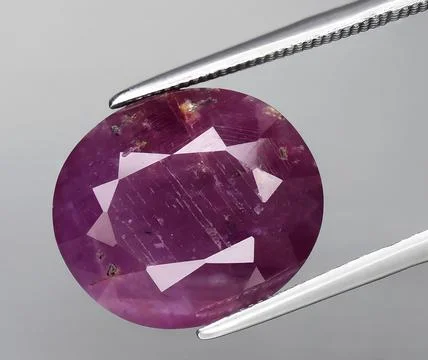 Natural red ruby corrundum gem on the background Stock Photos