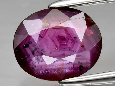 Natural red ruby corrundum gemstone on the background Stock Photos