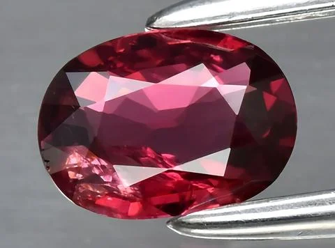 Natural red ruby gem on the background Stock Photos